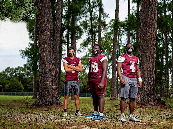 The Trojans have each been touched by COVID-19 in one way or another: Miguel (from left) had it; Ju-Marcus and Kameron watched it run through their families.